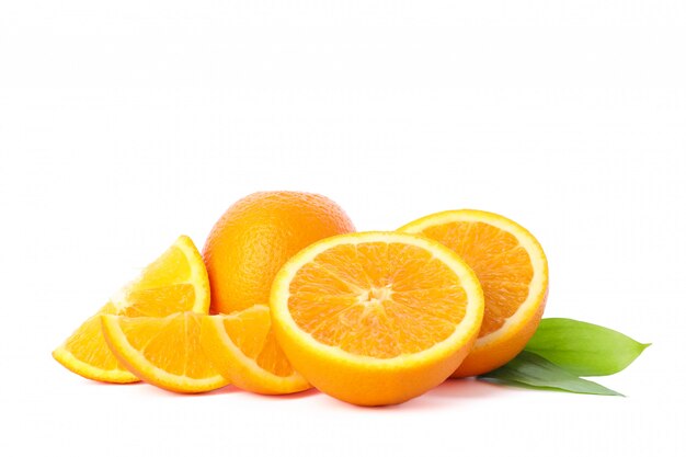 Ripe oranges with leaves isolated on white. Citrus food