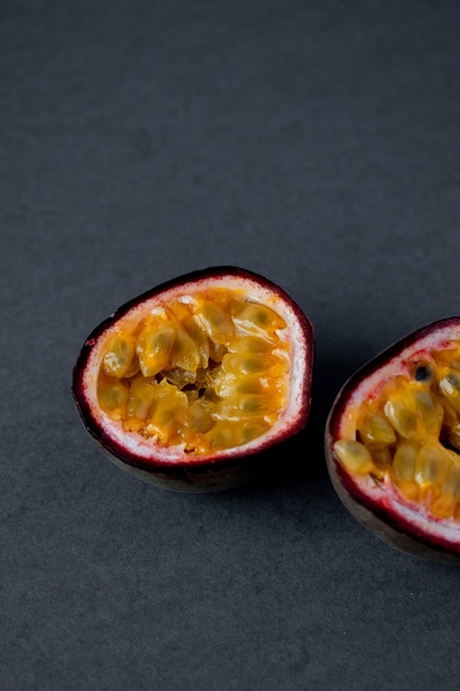 Ripe organic passion fruit on a dark background