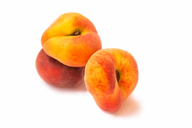 Ripe peach fruit isolated on white background