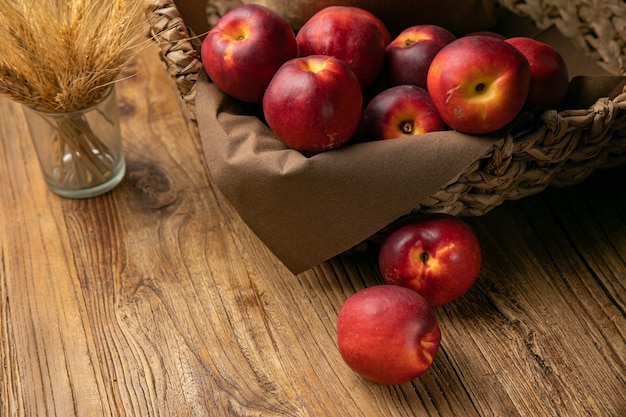 Ripe peaches on a wooden farm table