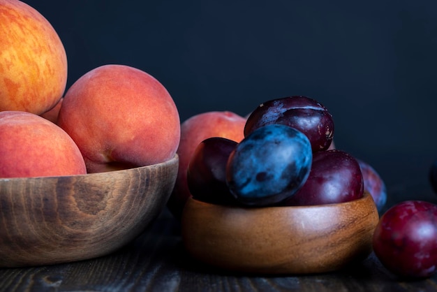 Ripe plums on the table in the kitchen several ripe and delicious plums on the table during meals