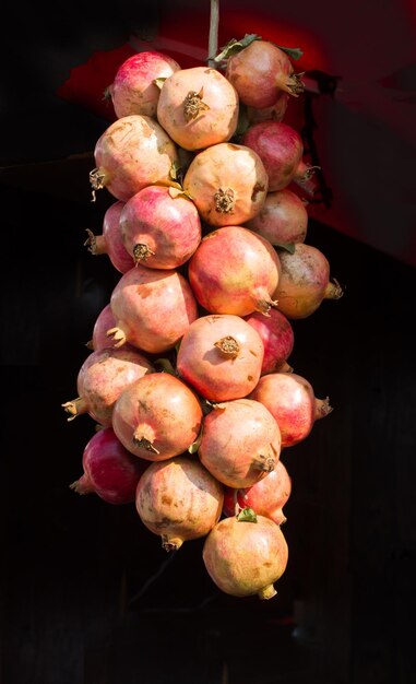 Ripe pomegranate fruit at a market place for sale