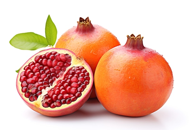 Ripe pomegranate fruit with leaves isolated on white background