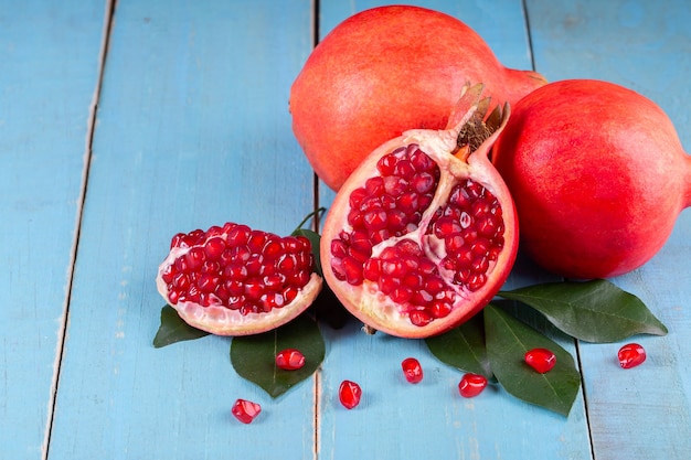 Ripe pomegranate fruits on the wooden background