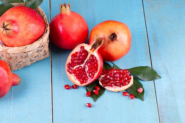 Ripe pomegranate fruits on the wooden background