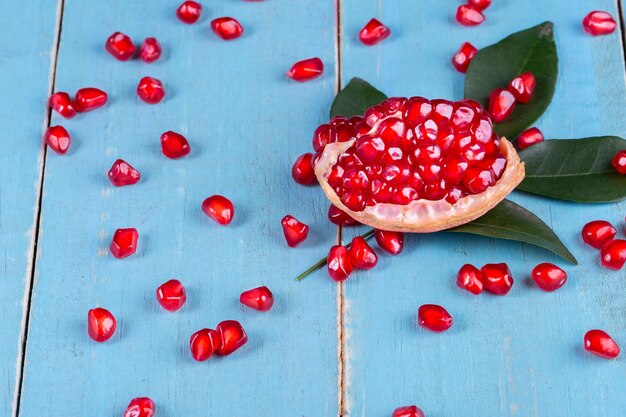 Ripe pomegranate fruits on the wooden background