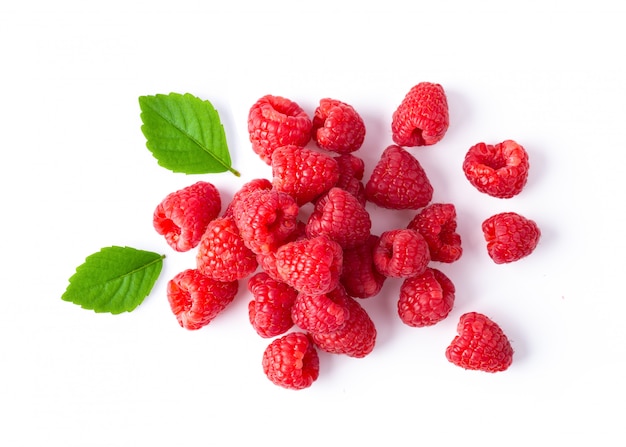 Ripe raspberries on white table. 