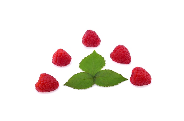 Ripe raspberries with green leaf isolated on white background