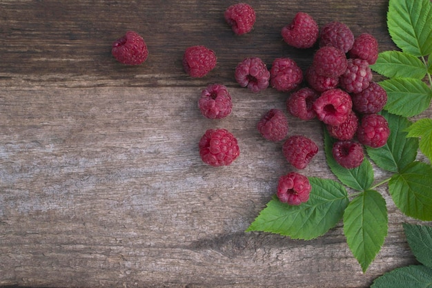 Ripe raspberries on a wooden table