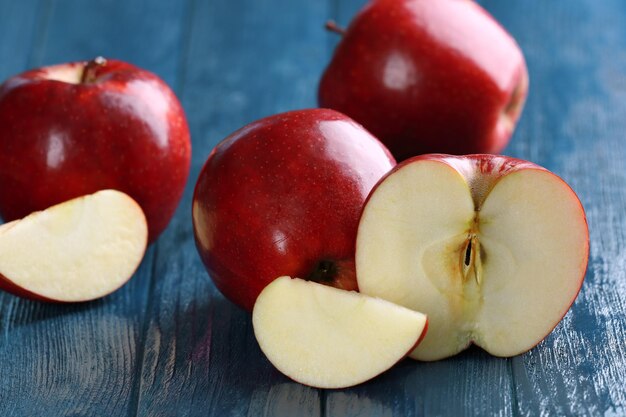 Ripe red apples on table close up