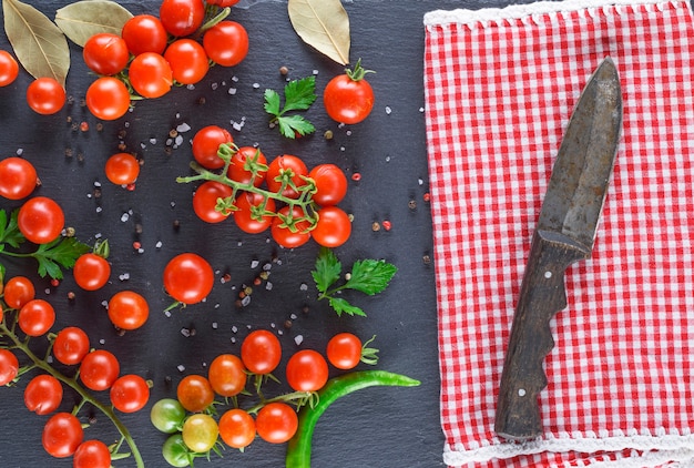 Ripe red cherry tomatoes and knife