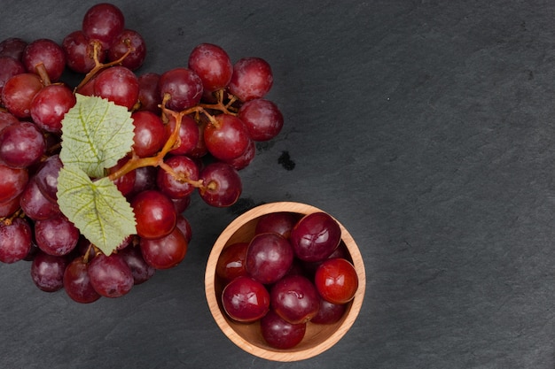 Ripe red grape on the dark background