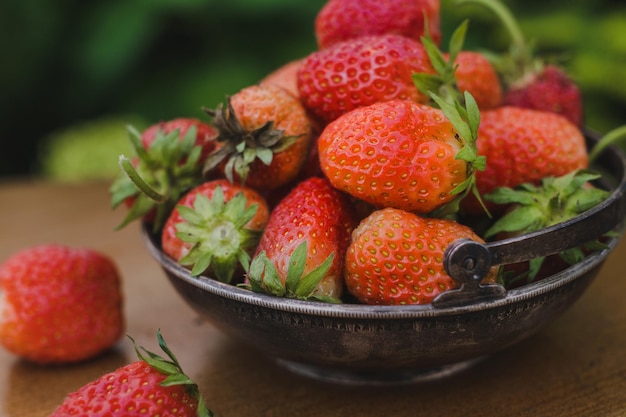 Ripe red organic strawberries outdoors