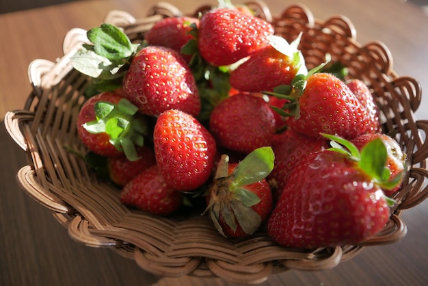 Ripe Red Strawberries in a bowl on table