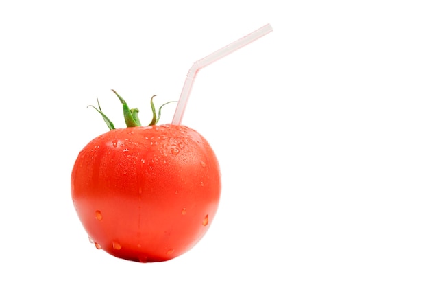 Ripe red tomatoes with drops and with a straw from the juice on a white background Isolated