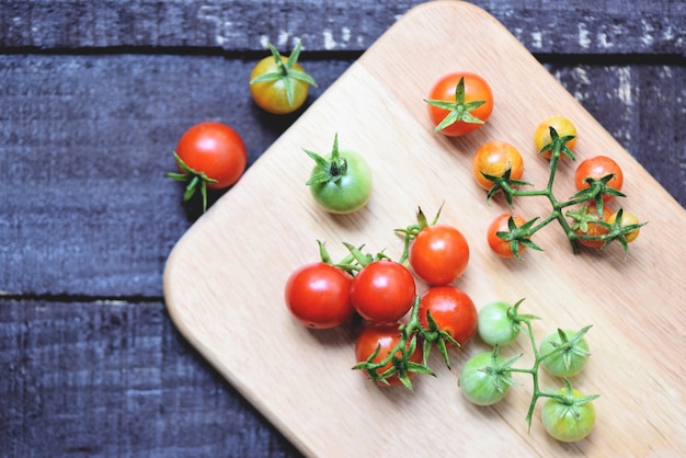 ripe red tomatoes on wood