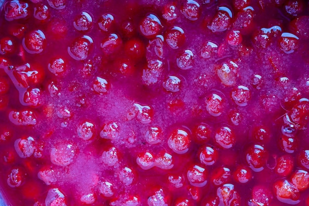 Photo ripe red viburnum closeup many berries viburnum in water background of red berries cooked for jam top view