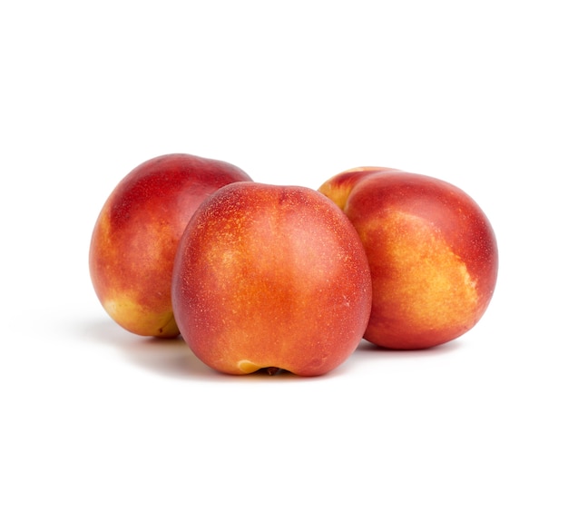 Ripe round red nectarine isolated, tasty and healthy fruit, close up