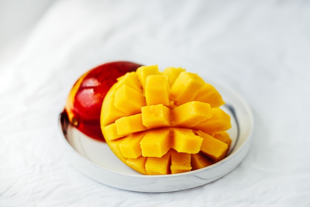 Ripe Sliced Mango on a white plate