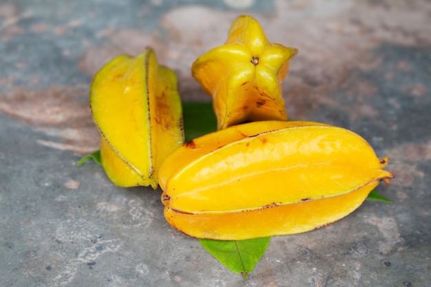 Ripe Star apple on dark wood