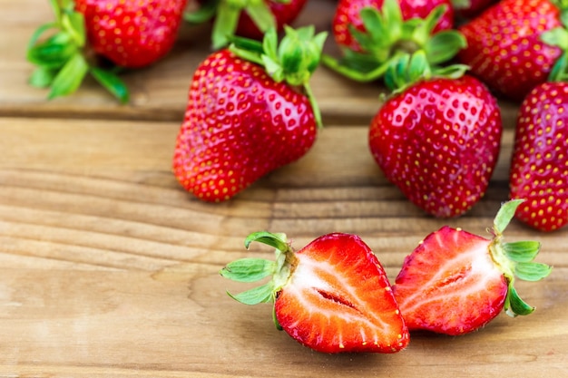 Ripe strawberries on a wooden table