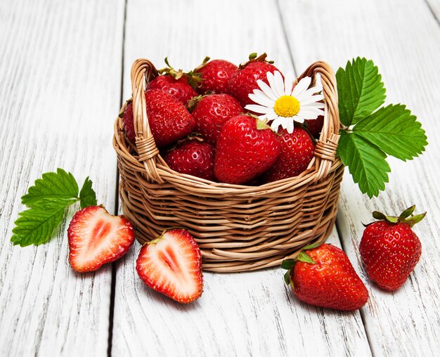 Ripe strawberries on wooden table