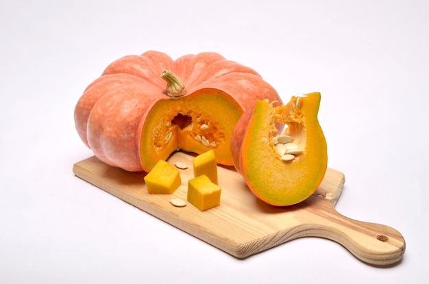 ripe strawberry pumpkin on board white background