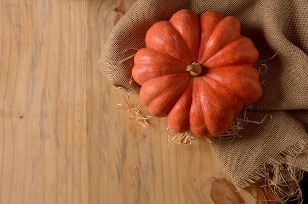 ripe strawberry pumpkin on the rustic table top view