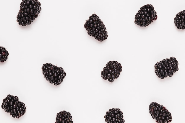 Ripe sweet blackberries on white background