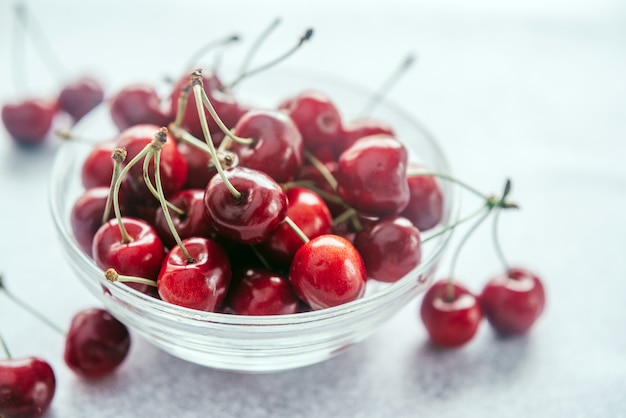 Ripe sweet cherries in a glass bowl, summer fruits high on antioxidants and vitamins