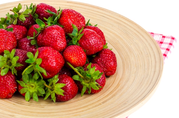 Ripe sweet farmer red strawberries on wooden dish