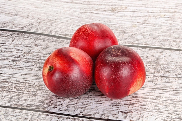 Ripe sweet juicy nectarines heap