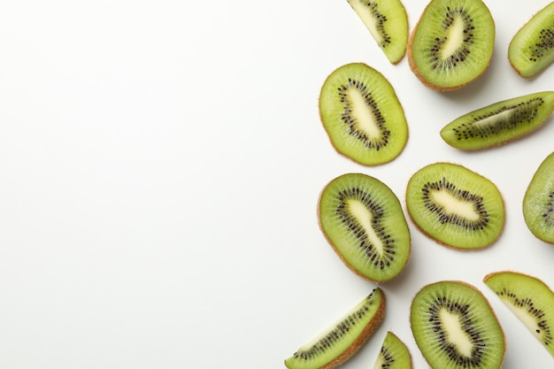 Ripe sweet kiwi on white surface