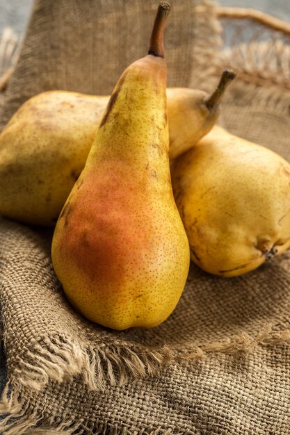     Ripe and sweet pears on wooden table