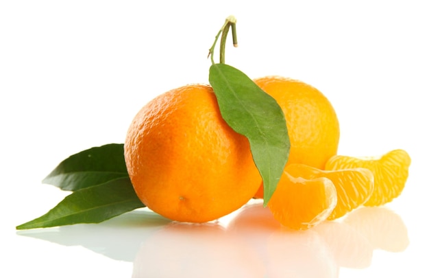 Ripe sweet tangerine with leaves isolated on white