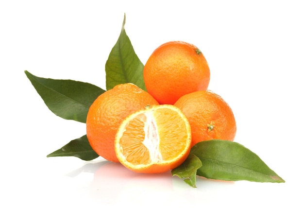 Ripe tasty tangerines with leaves and segments isolated on white