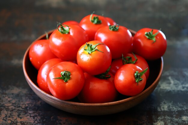 Ripe tomatoes in a bowl Harvest tomatoes