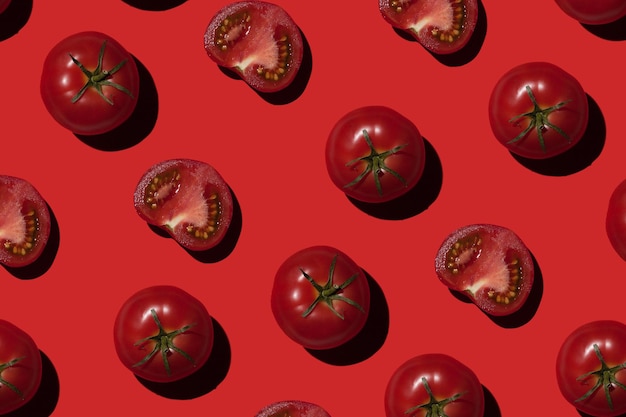 Ripe tomatoes on a red background Vegetables concept