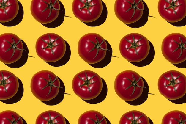 Ripe tomatoes on a yellow background Vegetables concept