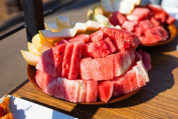 ripe watermelon with melon sliced on a plate