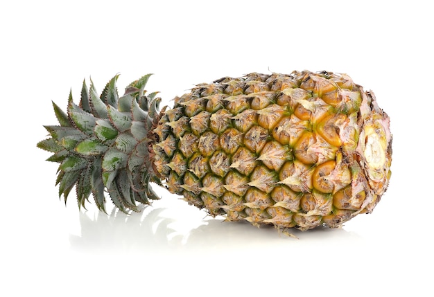 Ripe whole pineapple isolated on white