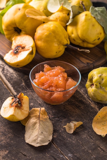 Ripe whole quince and sweet jam from it. Fresh fruit, an essential ingredient for a healthy diet