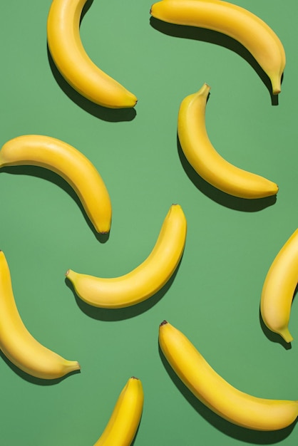 Ripe yellow bananas on a green background Texture pattern