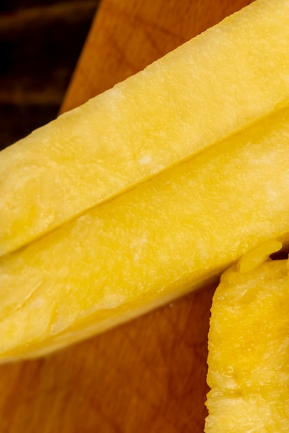 ripe yellow pineapple cut into pieces delicious and fresh pineapple cut into pieces during cooking