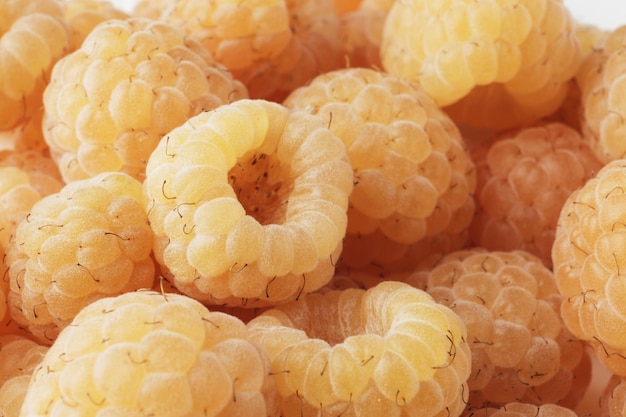 Ripe yellow raspberries as background closeup