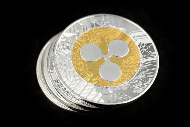 Ripple coin on black background Trading on the cryptocurrency exchange Cryptocurrency stock market concept