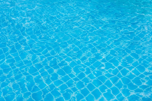 Ripple water swimming pool blue wave water on the outdoor swimming pool Summer background