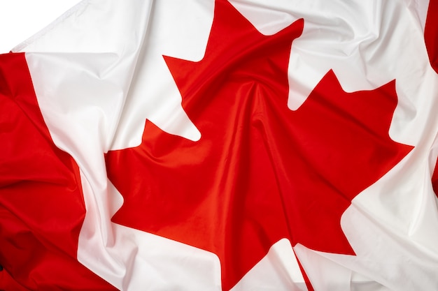 Rippled textile flag of Canada close up photo