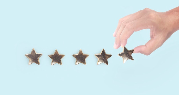 Rise on increasing five stars in human hand Increase rating