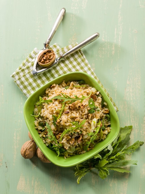 Risotto with arugula and nuts vegetarian food